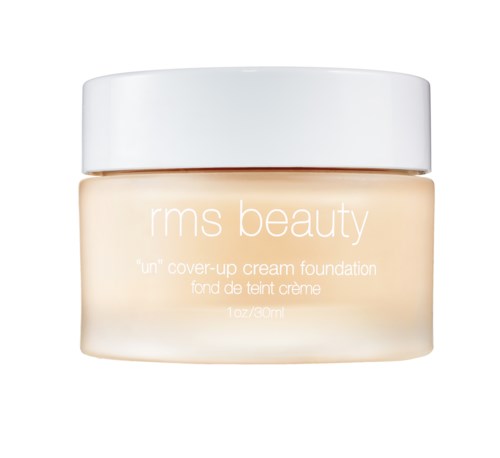 Een pot RMS Beauty 'Un' dekcreme foundation met een witte deksel en een crèmekleurige body.