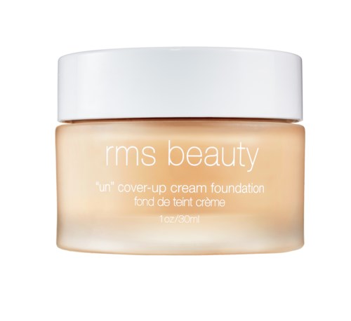En krukke med RMS Beauty 'un' dekkkremfundasjon med hvit lokk og beige kropp.