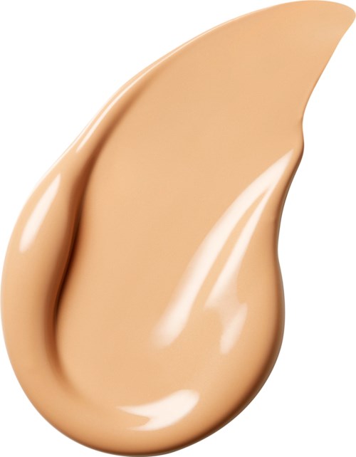 En dropformad klick av foundation eller concealer med glänsande, slät textur och beige färg.
