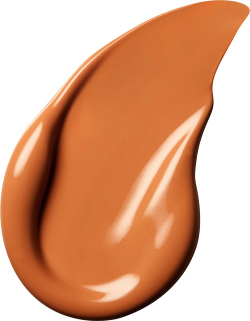 En slät, brun kosmetikgrundfärg eller concealervisning i form av tårdropp.