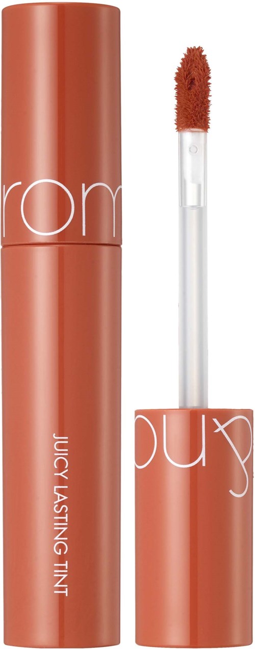 A lipstick tube with a doe-foot applicator, labeled 'Juicy Lasting Tint'. The packaging is orange with white text.