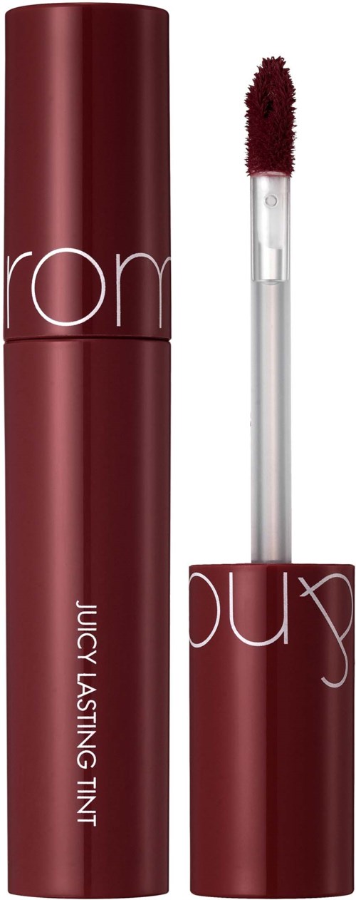 A lipstick tube with a dark red color and a wand brush showing. The brand name is partially visible.