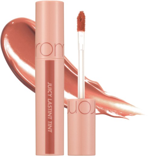 Lip gloss tube with a doe-foot applicator, resting on a glossy, peachy-pink smear.