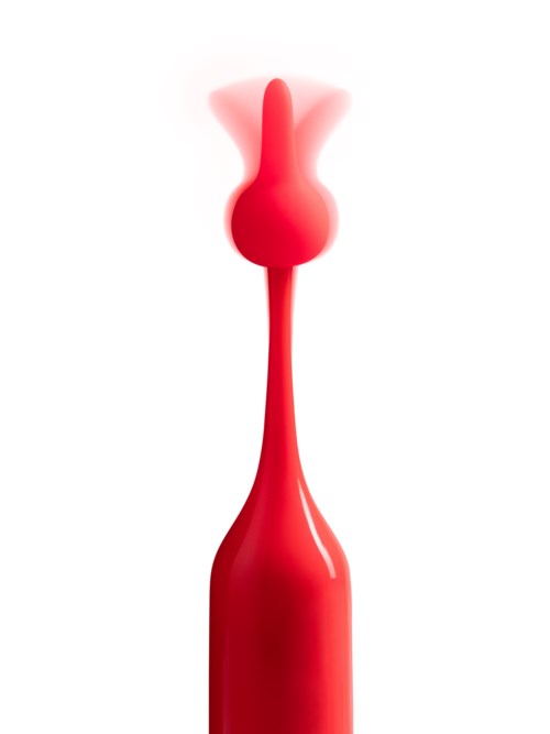 Een rood rubberachtig voorwerp met een lange smalle steel en een ronde top, met een wolk van rook of damp die eruit komt.
