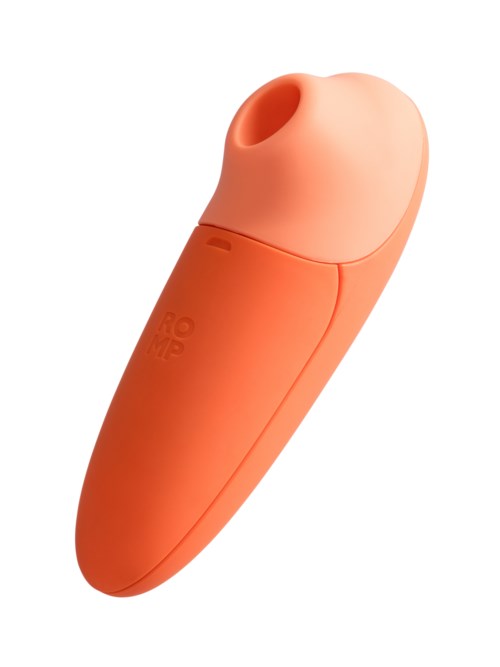 En liten, orange enhet med rund topp och ett hål, troligen en personlig vård- eller hälsoprodukt.