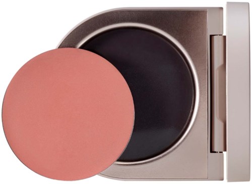 Ein kleiner runder Make-up-Schwamm und ein Behälter mit offenem schwarzen Deckel im Inneren.