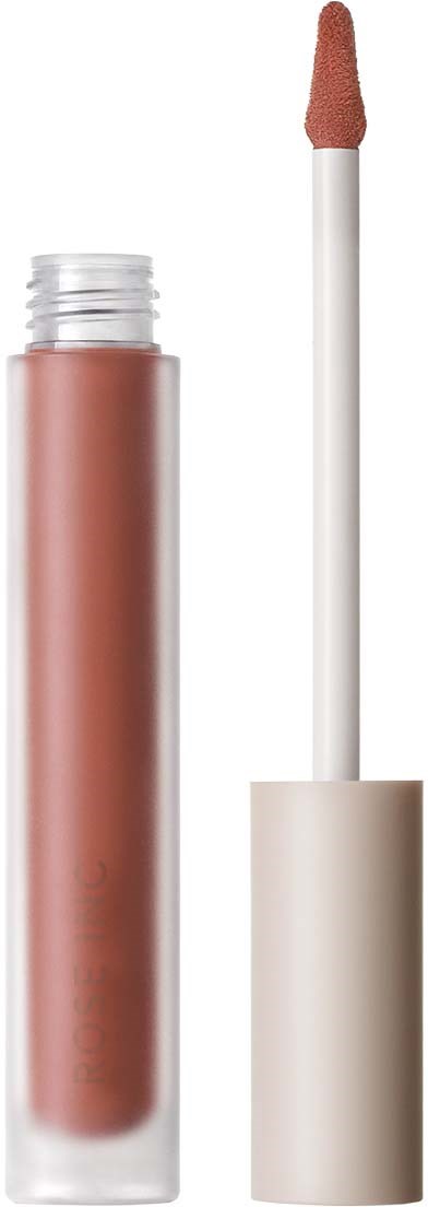 Lippenstift-Tube mit Applikatorschwamm, liegt vertikal. Der Glanz ist hellbraun. Konzentriere dich auf die Tube und den Pinsel.