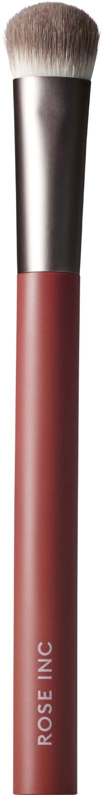 En makeupbørste med sølvfeste og rosa håndtak, merket "ROSE INC.".