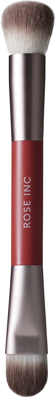 En dobbeltsidet makeup-børste med bløde børster, et rosa håndtag og 'ROSE INC' skrevet på den.