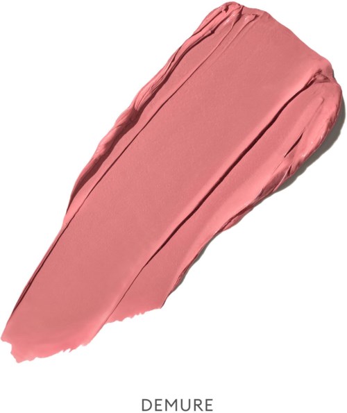 Ein Streifen in pfirsichfarbenem Make-up-Creme mit glatter Textur und leichtem Glanz.