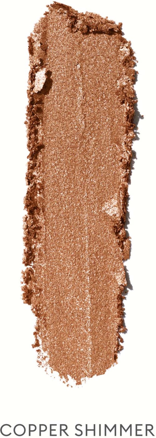 En prøve av kobberskimmer øyeskygge med en blank, metallisk finish og teksturerte kanter.