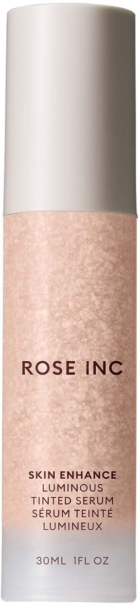 En produktflaska med vit lock och rosa etikett, som heter Rose Inc, för hudserum.