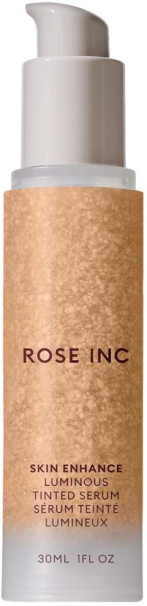 En vit flaska med beige etikett och pump, märkt 'ROSE INC' för hudserum.