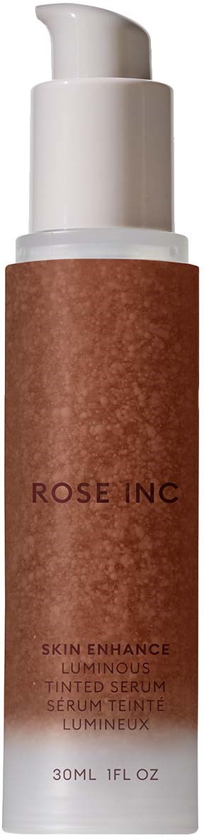 En brun flaska med vit pumpkapsel, märkt 'ROSE INC' och 'Skin Enhance Luminous Tinted Serum.'