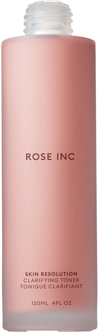 En rosa flaske merket 'Rose Inc' med klar lokk og tekst om ansiktstoner inni.
