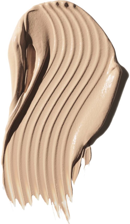Prov av beige krämig texturerad makeup eller färg med böjda linjer och slät finish.