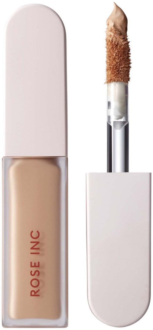 En beige flytande concealer med ett vitt fodral och en applikator med svampstift.