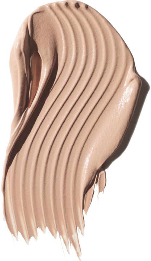 En beige, krämig konsistens med vågiga, ribbade linjer visar makeup eller kosmetika.