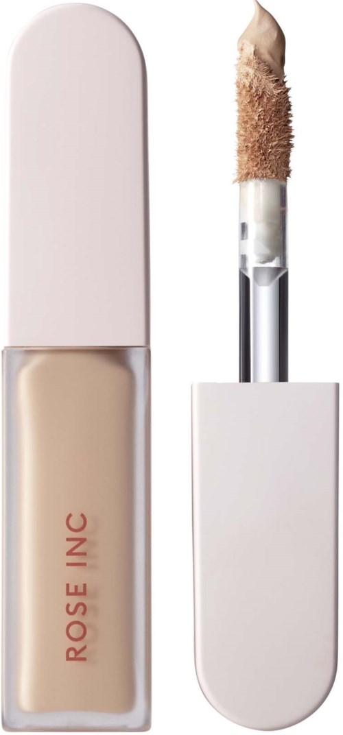 En beige flytande concealer i en vit tub, med en applicatorstift.