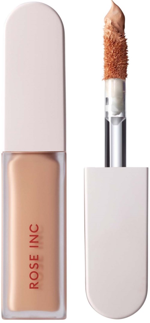 En beige flytande concealare med vit lock och spongeapplikator.