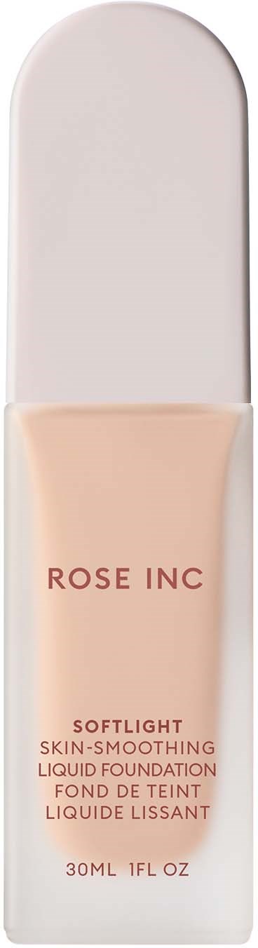 En tube med flytende foundation i en klar, buet beholder med hvit lokk. Merket sier 'ROSE INC' og produktdetaljer.