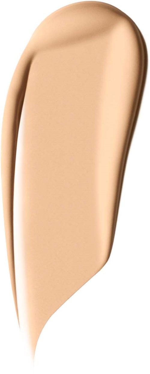 Ein beige flüssiger Foundation-Tupfer mit glatter, cremiger Textur vor schwarzem Hintergrund.