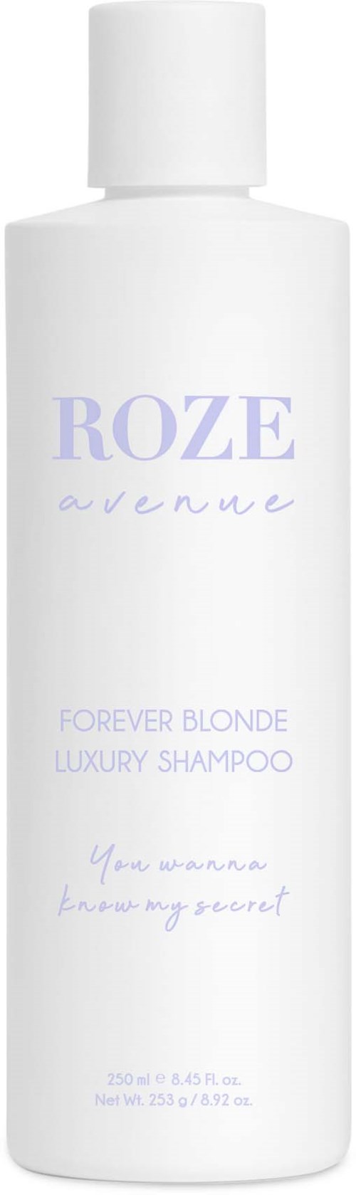 En hvid shampoo-flaske med lilla tekst, mærket "Roze Avenue," til blond hår og luksusbrug.