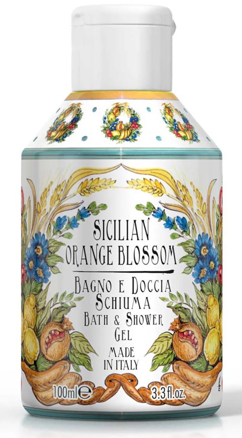 En dekorativ flaska med blå blommor, citroner och apelsinblommor, märkt för bad- och duschgell från Italien.