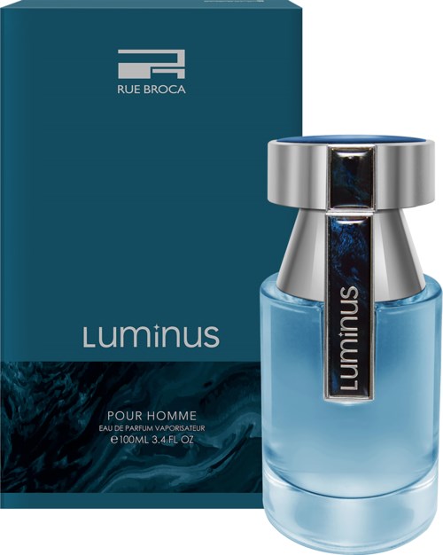 A perfume bottle with a blue liquid, silver cap, and a dark label. Box in the background has blue and dark colors.