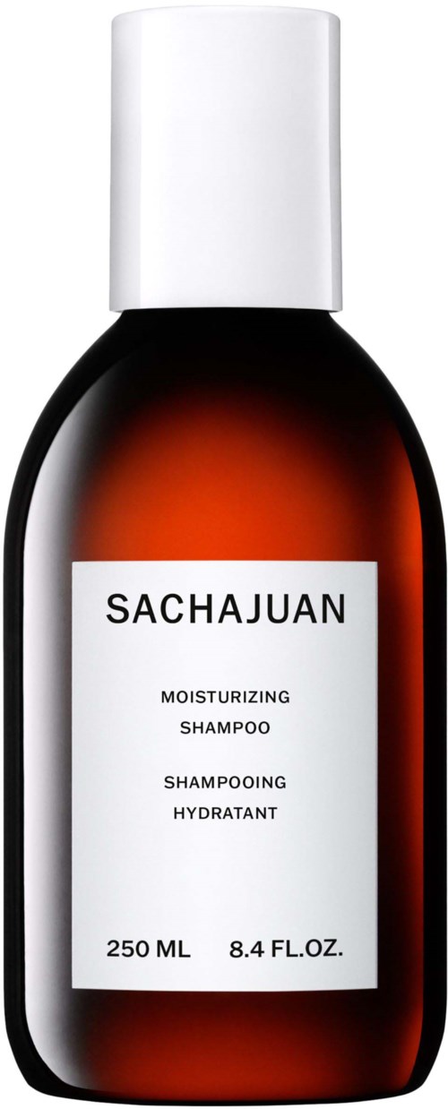 En brun flaske med hvid hætte og label, der siger "Sachajuan Moisturizing Shampoo."