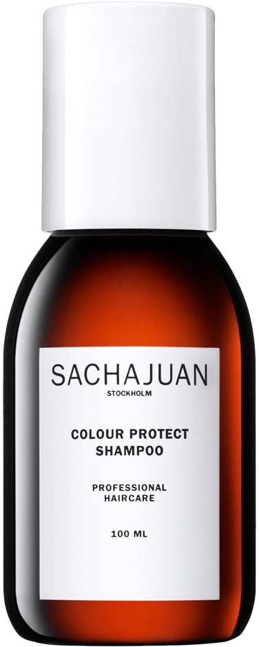 Pieni, ruskea pullo, jossa valkoinen korkki ja etiketti 'SACHAJUAN Colour Protect Shampoo'.