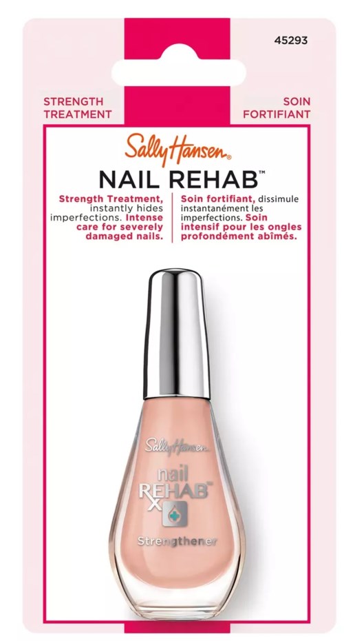 Een nagelverzorgingsproduct met een roze en zilveren fles, genaamd Sally Hansen Nail Rehab, voor beschadigde nagels.