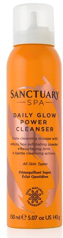 Oransje flaske med Sanctuary Spa Daily Glow Power Cleanser med mikropeelingpulver og milde enzymer.