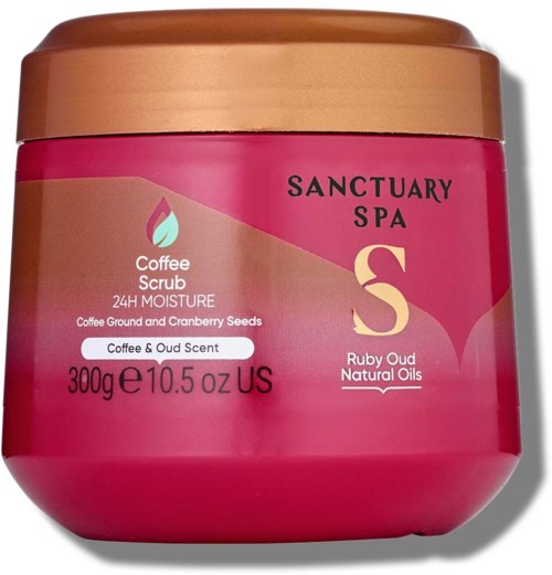 A pink and gold container for Sanctuary Spa coffee scrub, featuring a daytime moisture label, and ingredients like coffee and cranberry seeds.