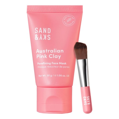 Pink tube med australsk rosa leirmaske og en liten børste ved siden av.