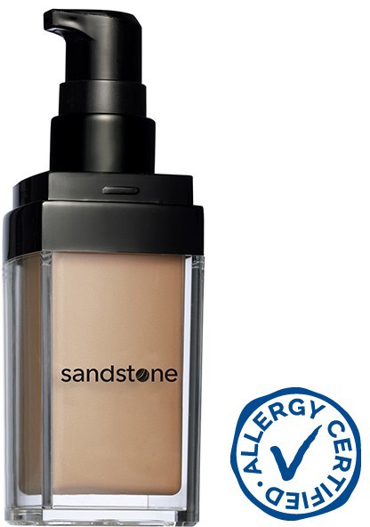 En flaska av Sandstone foundation med pump och ett allergitestmärke längst ned till höger.