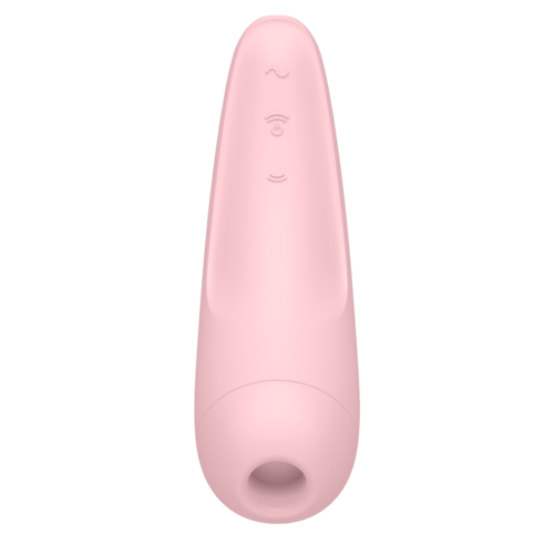 En rosa enhet med et enkelt ansiktendesign, rund topp og et hull nederst.