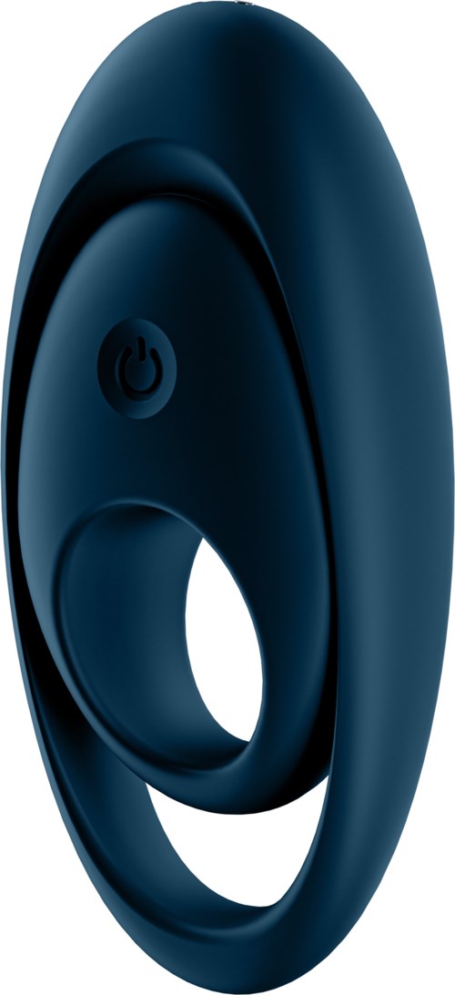 A circular black device with a power button on it, possibly a wearable gadget or smart device.