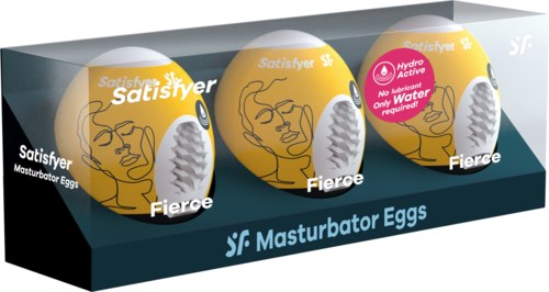 Tre gule egg med ansiktsillustrasjoner og merker, plassert i en klar boks merket "Masturbator Eggs".