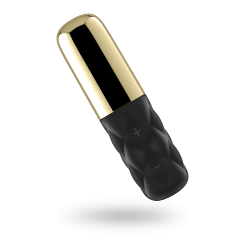 En liten handhållen enhet med guld- och svarta delar, verkar vara en bärbar elektronisk pryl.