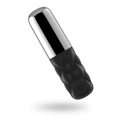 En liten enhet med en skinnende metallaktig topp og et svart, textured håndtak. Den ser ut som en massasje- eller vibrasjonsenhet.