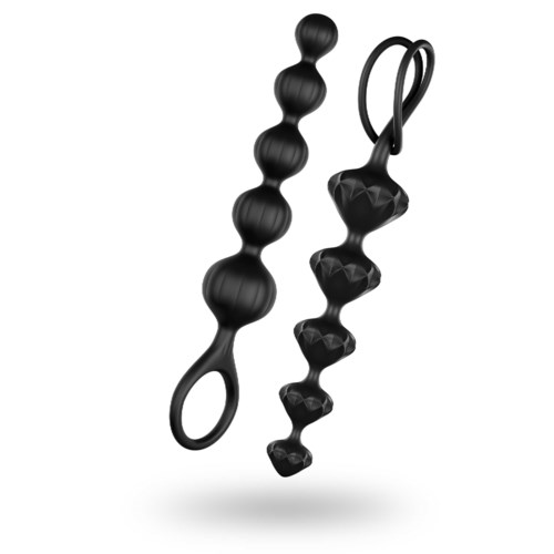 To sorte, teksturerede objekter med perle- og geometriformer, begge med håndtag.