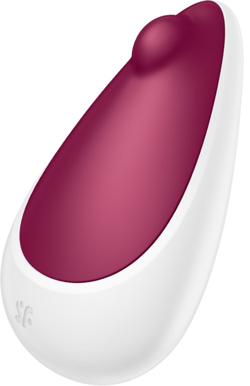 En enhet med rosa topp og hvit bunn, formet som en oval, sannsynligvis en massasjeenhet eller gadget.