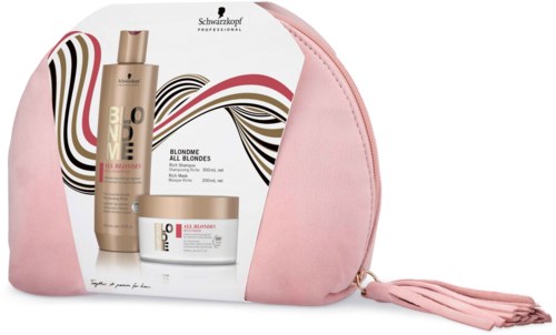A pink bag with a product set inside, including shampoo, conditioner, and cream, on a white background.