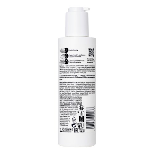 En vit flaska med pump, streckkod och många etiketter med liten text och symboler.