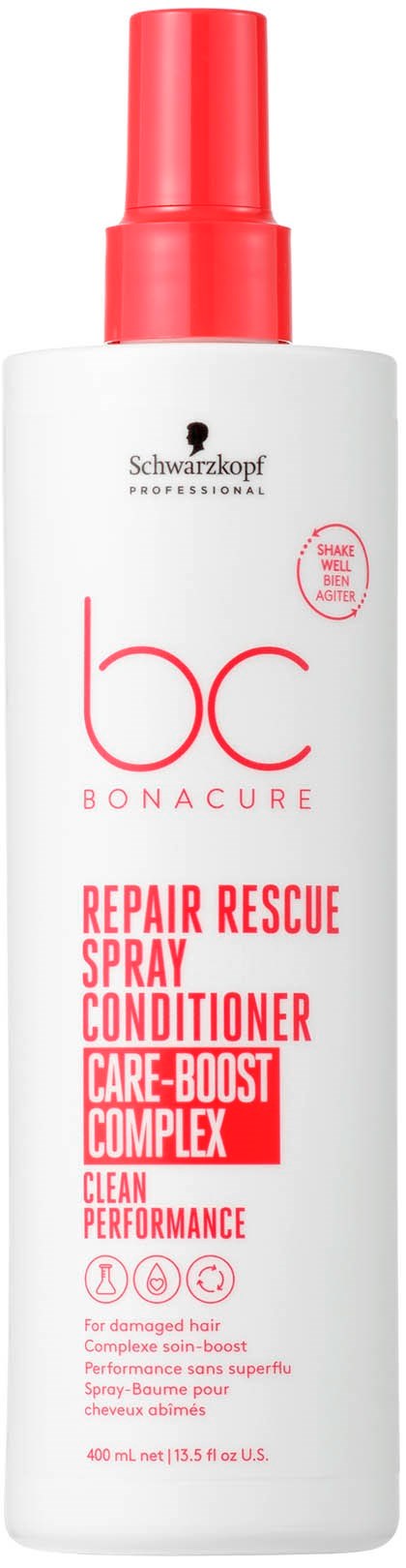 En vit flaska med rött spraylock, märkt 'Bonacure Repair Rescue Spray Conditioner'. Den påstår sig stärka och reparera håret.