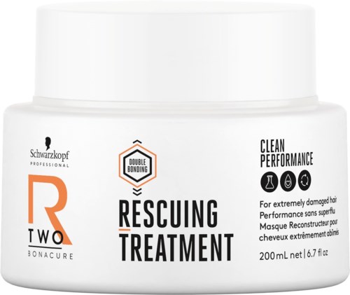 En vit behållare märkt Rescuing Treatment för skadat hår, med ikoner som visar vård och prestanda, 200 ml kapacitet.