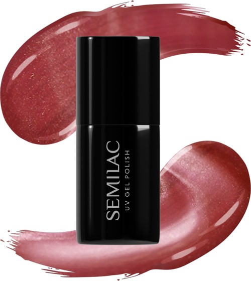 Black nail polish bottle with white text, surrounded by pinkish polish swipes and smudges.