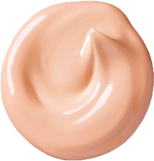 En hvirvel af beige flydende, ser glat og skinnende ud, med en lille spids i midten.