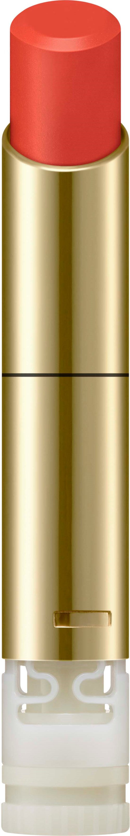 Ein Lippenstift in goldener Hülle mit rotem Lippenstift und klarem Boden.